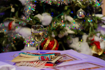 Drink on table against christmas tree