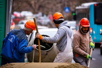 Rear view of people working