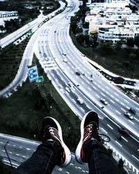 Low section of people walking on road