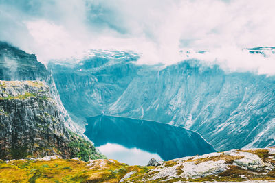 Scenic view of waterfall against sky