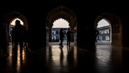 People walking in corridor of building