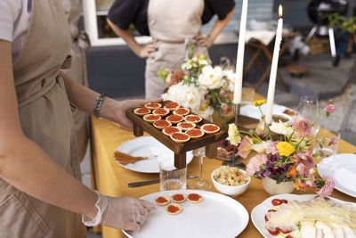 Midsection of people having food