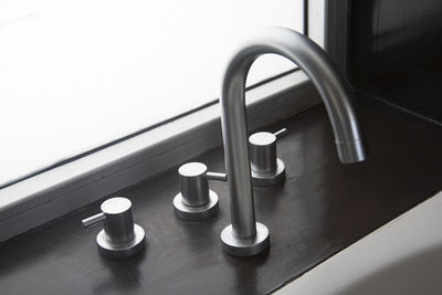 High angle view of faucet on table