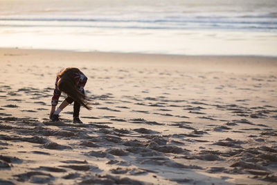 Full length of person walking on beach