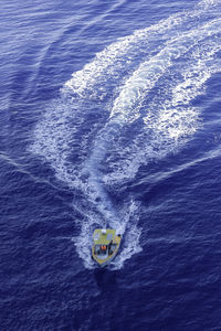 High angle view of people on boat in sea