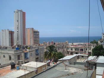 Buildings by sky and sea