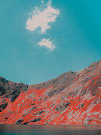 Low angle view of mountain against blue sky