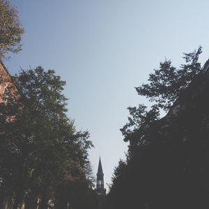 Low angle view of built structure against clear blue sky