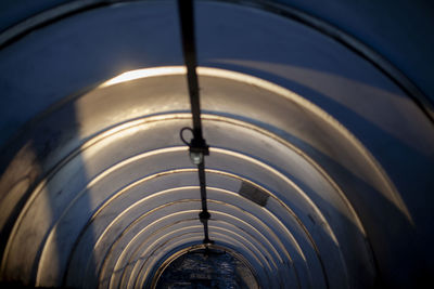 Pedestrian tunnel for crossing over the road. a rounded tunnel extending into the distance. 