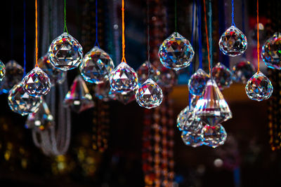 Close-up of crystals hanging in store for sale