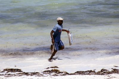 Woman standing on shore