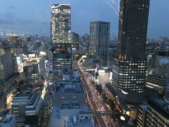 High angle view of illuminated buildings in city against sky