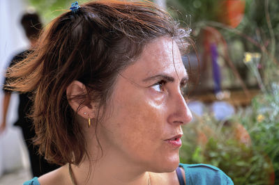Close-up of young woman looking away