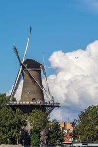 Traditional windmill against blue sky