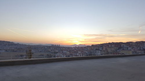 High angle view of cityscape against sky during sunset