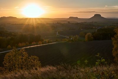 Scenic view of landscape against sky during sunset