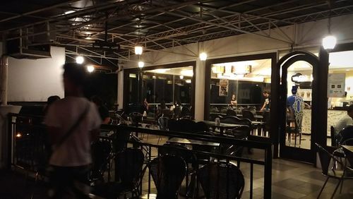 Man standing in illuminated room