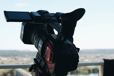 Low angle view of camera against sky