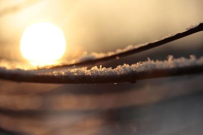 Close-up of sun shining through clouds