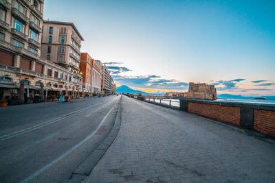 Street amidst buildings against sky