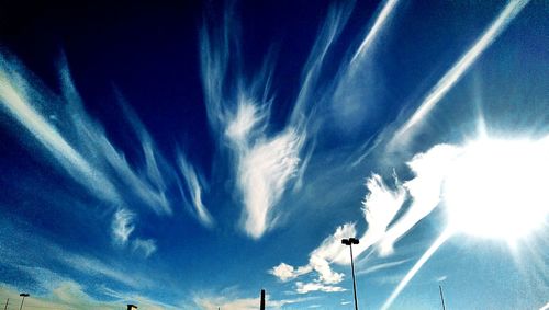 Low angle view of vapor trails in sky
