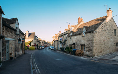 Street amidst buildings against sky