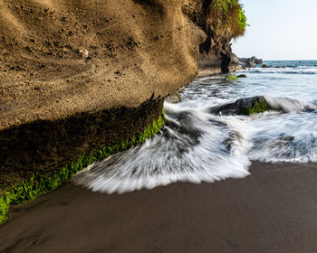Long exposure shot of sea waves breaking on beach