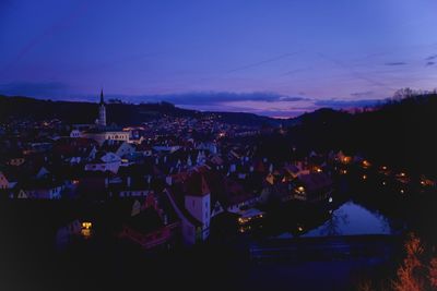 High angle view of illuminated townscape against sky at night