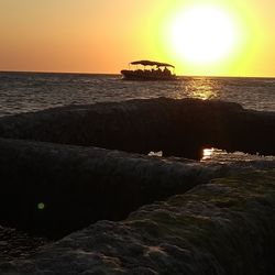 Scenic view of sea against clear sky during sunset