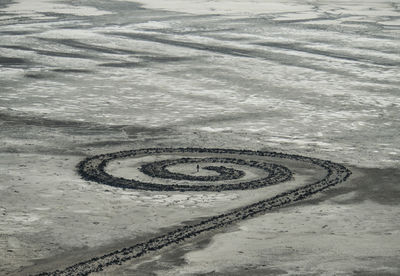 High angle view of spiral pattern on sand at great salt lake