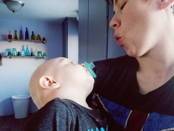 Close-up of mother and daughter at home