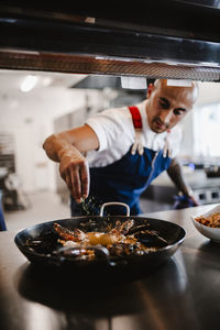 Chef preparing paella