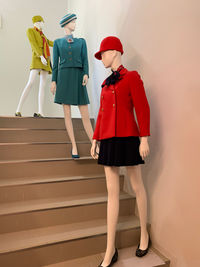 Rear view of women standing on staircase