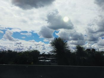 Scenic view of landscape against cloudy sky