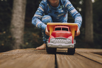 Close-up of boy playing with toy