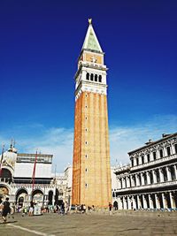 Low angle view of church against blue sky