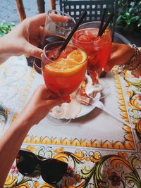 Midsection of woman holding drink