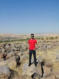 Full length of man standing on rock