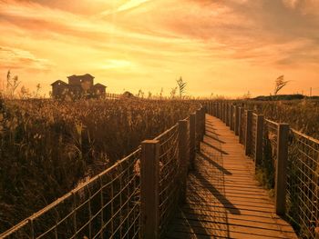 Scenic view of field against sky during sunset