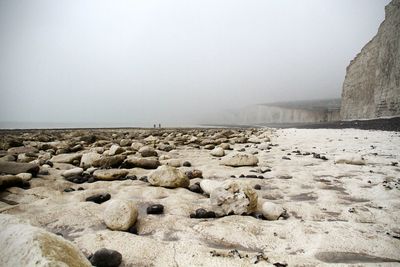 View of calm beach against sky