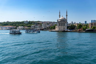 Ferry tour on the sea front of historical mosque in istanbul