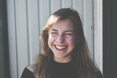 Close-up portrait of a smiling young woman