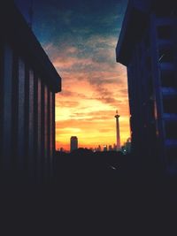 Silhouette of building at sunset