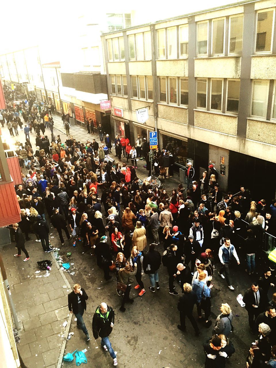 large group of people, crowd, person, street, building exterior, men, lifestyles, city, high angle view, built structure, architecture, leisure activity, city life, abundance, market, large group of objects, crowded, walking, outdoors