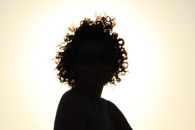 Close-up of silhouette woman against white background