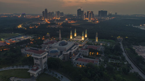 High angle view of city buildings at night