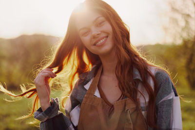 Portrait of young woman during sunset