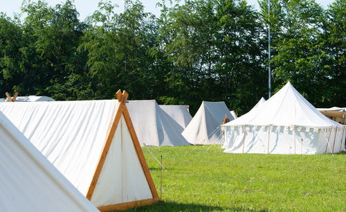 Tent on field against trees