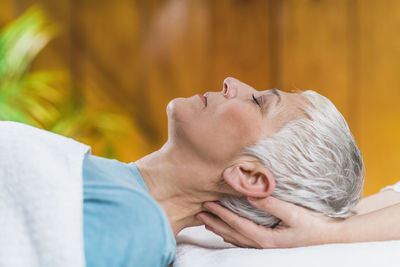 Close-up of woman getting massage at spa