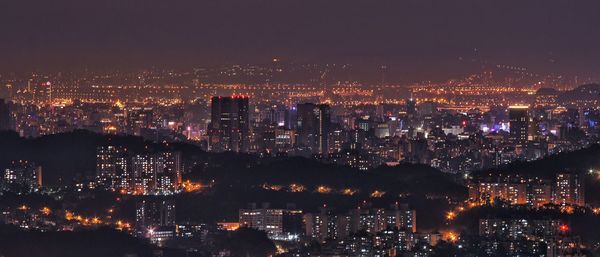 Illuminated cityscape at night